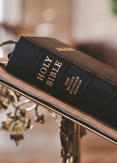 Close-up of Holy Bible resting on church podium